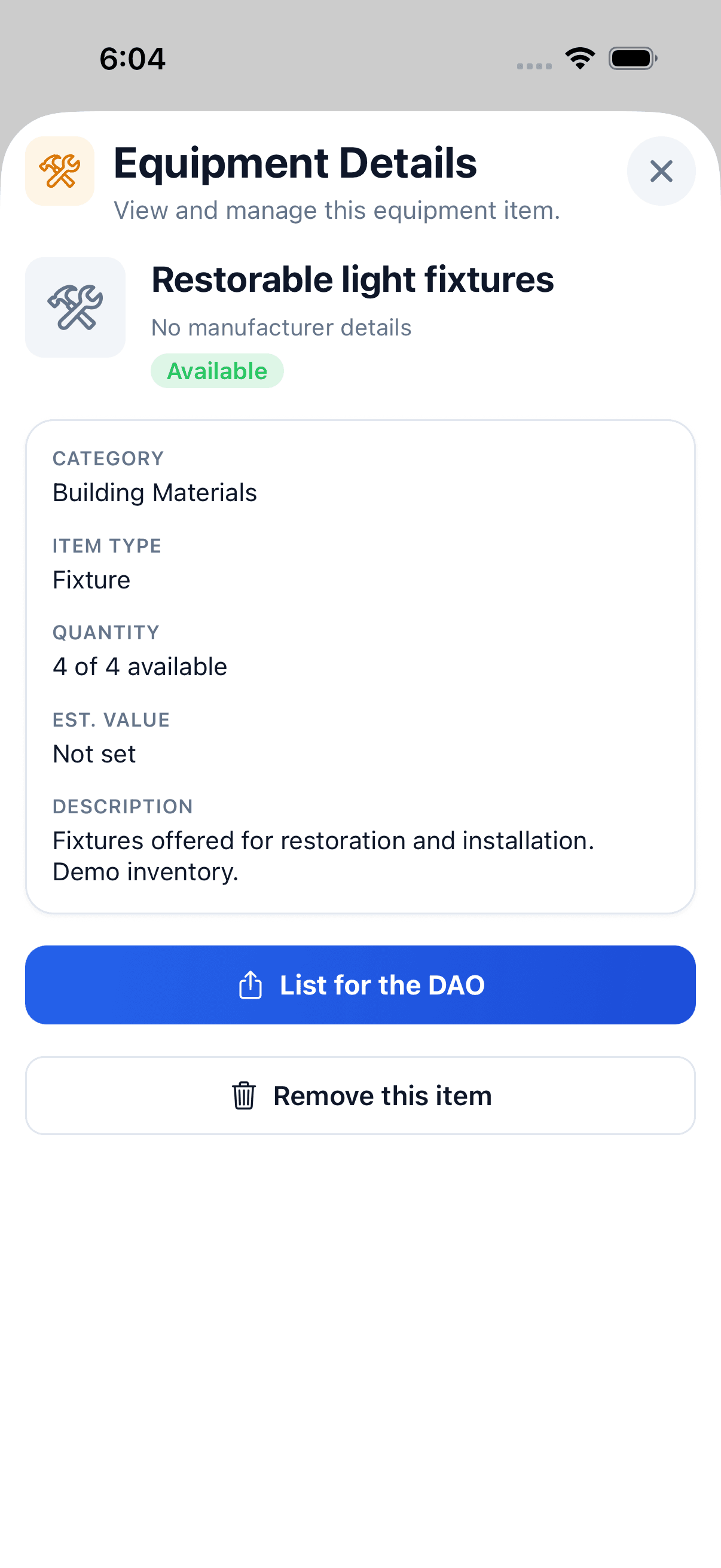 Native iPhone Equipment Details sheet for four sample restorable light fixtures, showing category, quantity, description and List for the DAO action.